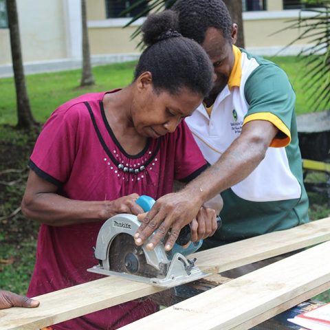 A workshop participant at Agriculture College building Food Solar Drier for Food preservation