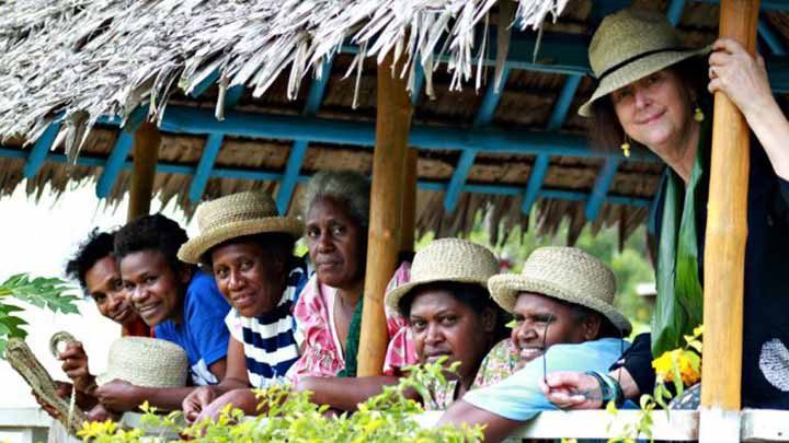 Rosie Boylan and some local Vanuatu women wearing her hats
